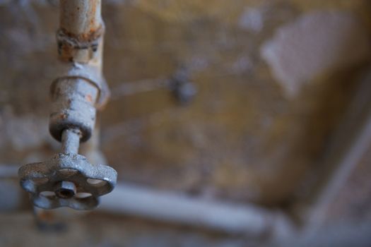 Old rusty tap. Horizontal close-up photo