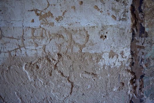 Texture of old wall with damaged plaster. Horizontal photo