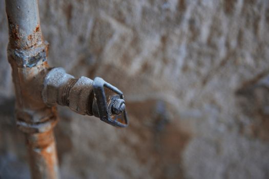 Old rusty tap. Horizontal close-up photo