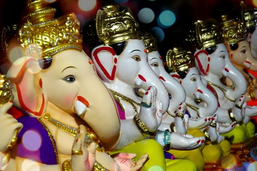 Ganesha Idols with different moods and poses for sale during Ganesha festival in India                               