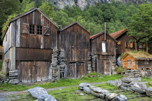 Old wooden houses at the waterfront in Geiranger