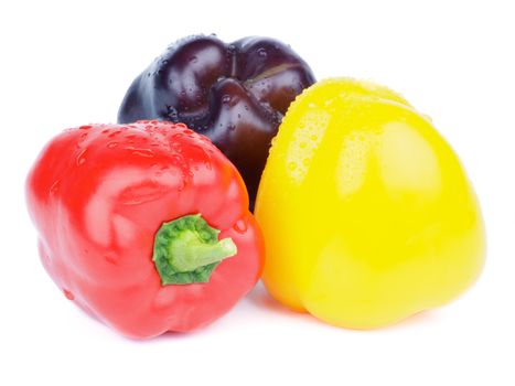 Heap of Red, Yellow and Purple Fresh Bell Peppers isolated on white background