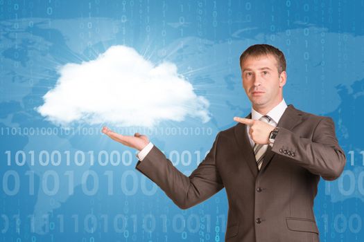 Businessman holding white cloud. World map with figures on the background
