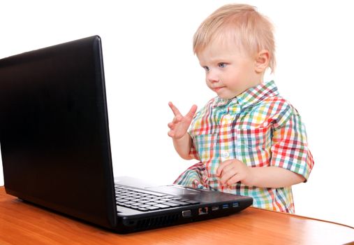 Cheerful Baby Boy with Laptop Isolated on the White Background