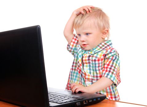 Surprised Baby Boy with Laptop Isolated on the White Background