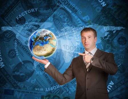 Business man hold Earth in hand. World map and money on background. Elements of this image are furnished by NASA