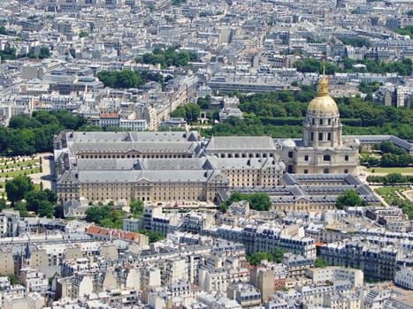 Photo is showing various views onto Paris, France with its many houses and roofs.