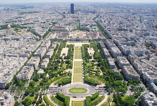 Photo is showing various views onto Paris, France with its many houses and roofs.