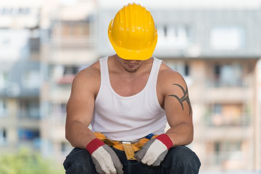 Construction Worker Relaxing The Fresh Air During Work