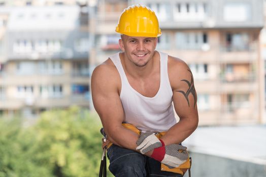 Construction Worker Relaxing The Fresh Air During Work