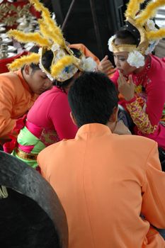 Bandung, Indonesia - March 9, 2008: Dancer member and musical crew gather together and make preparation before get performing on stage at Tegalega Park Bandung, West Java-Indonesia.