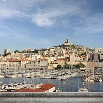 Marseille cityscape with famous landmark Notre Dame de la Garde church, France.