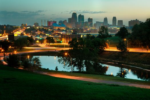 A horizontal image of downtown Kansas City, Missouri at sunrise.  The image is free of any trademark signs or on buildings.