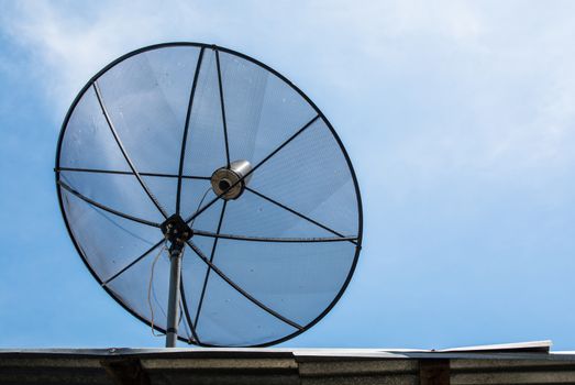 the beautiful satellite dish on the top roof under blue sky