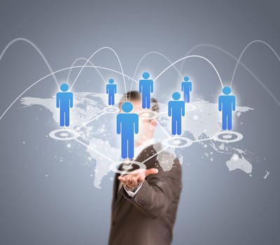 Businessman in suit holding world map with peoples icons. Network concept