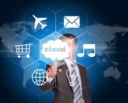 Business man pointing her finger at cloud with icons. Technology concept. World map as backdrop