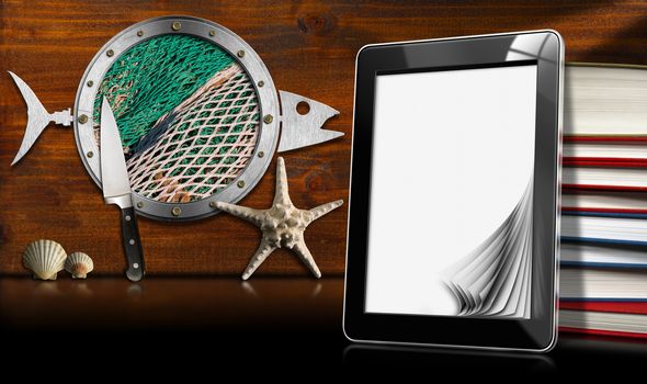 Tablet computer with blank pages and books on wooden wall with metal porthole fish shaped, seashells, starfish and kitchen knife. Template for recipes or seafood menu