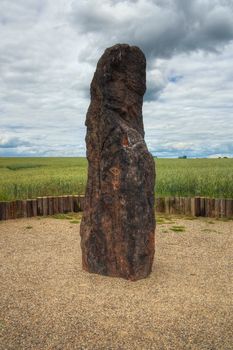 Menhir Stone Shepherd (also Stone Man, Petrified Man or Petrified minister) is a menhir standing alone in a field 1 km northwest of the village Klobuky, district Kladno. This is the highest menhir in the Czech Republic.  3.5 m tall columnar rock uncut dark iron Cretaceous sandstone. This is one of the few stones in the country, which we can with high probability be considered a real prehistoric menhir.