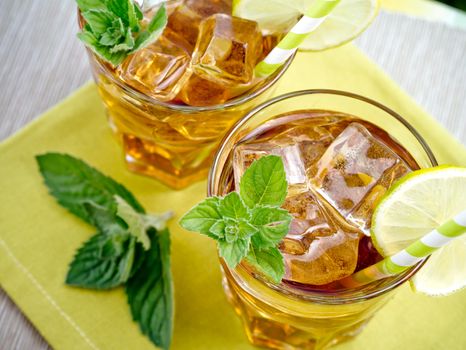 Refreshing peach, lime and mint ice tea served outdoors