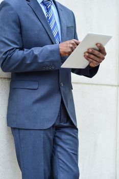 Cropped image of businessman who operates a tablet PC