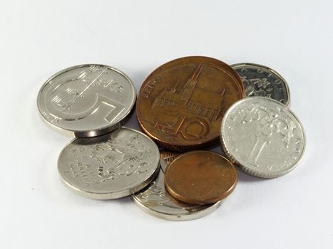 Photo presents details of coins set on the white background.