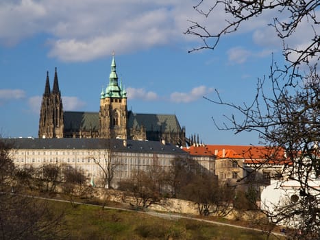 Photo shows various historical houses, red roofs and other architectural details.