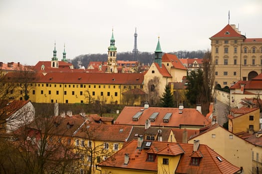 Photo shows various historical houses, red roofs and other architectural details.