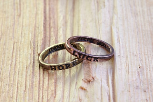 Photo shows details of rings on the wooden background.