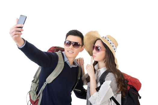 Asian young traveling couple selfie, full length portrait isolated on white background.