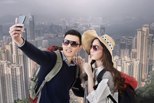 Asian couple travel and selfie in Hong Kong, Asia.