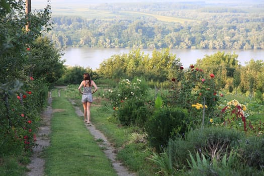 Young woman walking in the garden