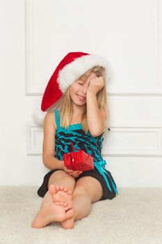 Cute little girl in the santa claus hat