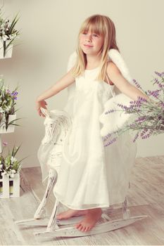 a Baby girl in an angel dress