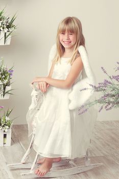 a Baby girl in an angel dress