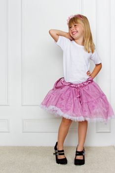 girl in a pink dress. studio shot
