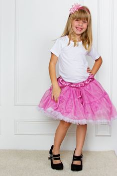 girl in a pink dress. studio shot
