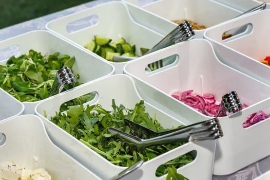 catering, eat out, white porcelain trays with salad ingredients