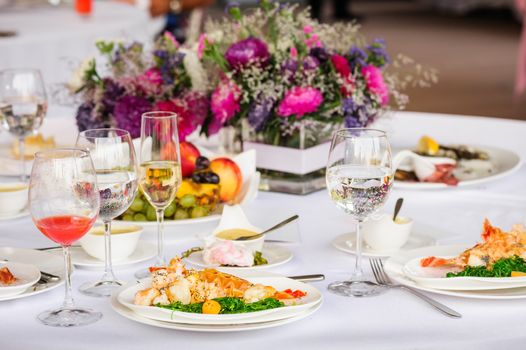 Prepared lobster and sea weed served on plates