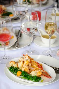 Prepared lobster and sea weed served on plates