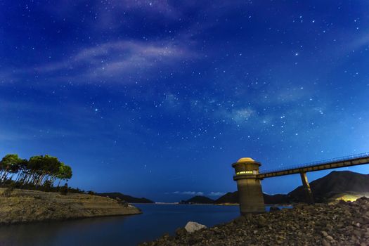 Smooth surface of the lake on a background the starry sky