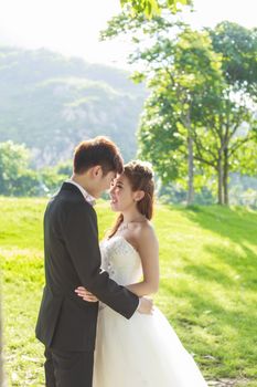 Bride and groom in the park