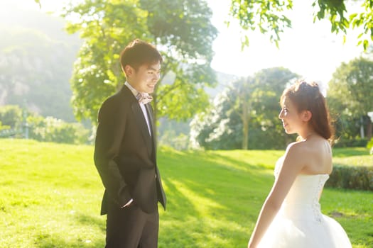 Bride and groom in the park