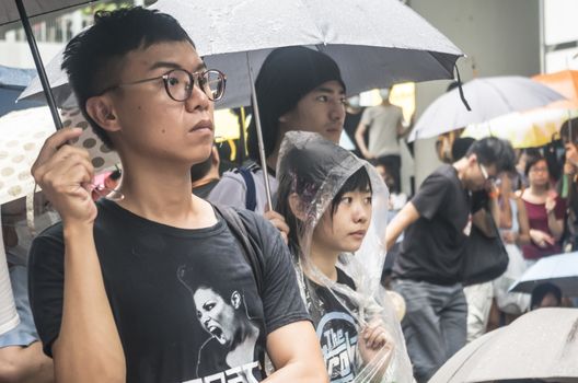 HONG KONG - JUNE 20: Protesters gathered outside the government headquarters on June 20, 2014 in Hong Kong. The Finance Committee is vetting a funding request about northeast New Territories.