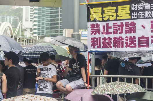 HONG KONG - JUNE 20: Protesters gathered outside the government headquarters on June 20, 2014 in Hong Kong. The Finance Committee is vetting a funding request about northeast New Territories.