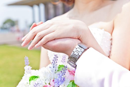 Couple hands closed together outdoors