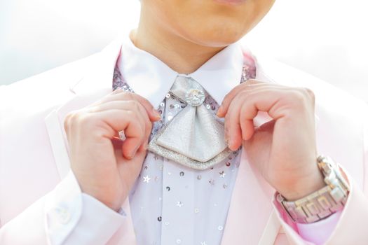 Young man adjusting his suit 