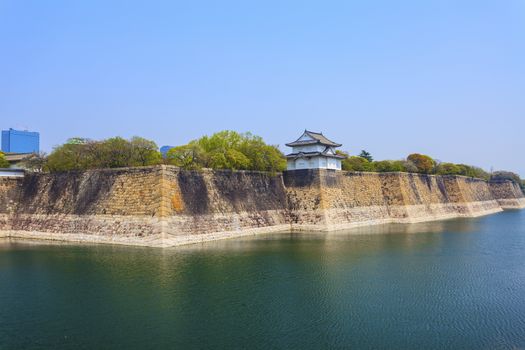 Osaka Castle wall at riverside in Japan
