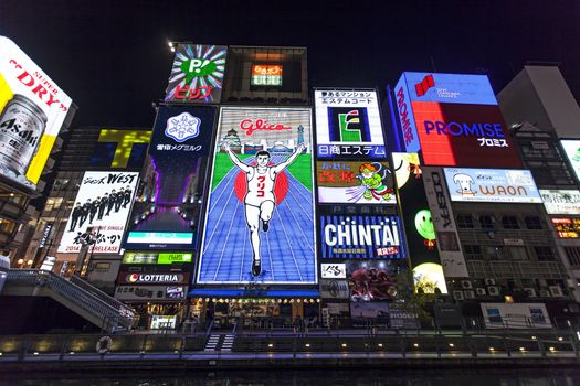 OSAKA - APRIL 16: The famed advertisements of Dotonbori on April 16, 2014 in Osaka, Japan. With a history reaching back to 1612, the districtis now one of Osaka's primary tourist destinations.