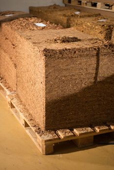 Bulk tobacco in cubes in a cigarette factory