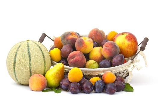 fresh fruits in a basket on white background